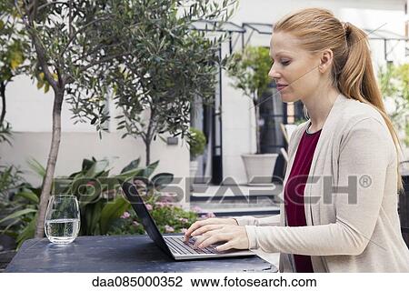 Writer using laptop computer outdoors View Large Photo Image Stock Image - Writer using laptop computer outdoors. Fotosearch