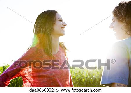 Stock Photography - Young couple chatting. Fotosearch