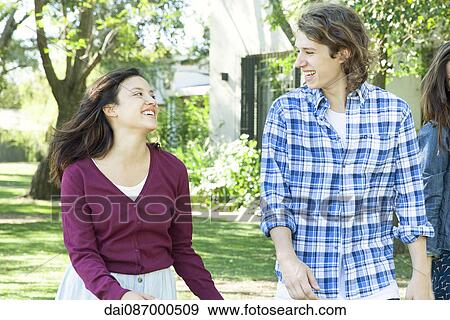 Young couple flirting View Large Photo Image Stock Photo - Young couple flirting. Fotosearch