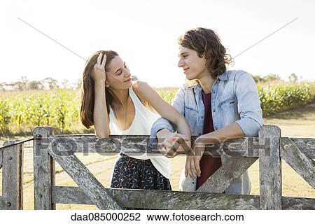 Young couple holding hands, portrait View Large Photo Image Stock Image - Young couple holding hands, portrait. Fotosearch