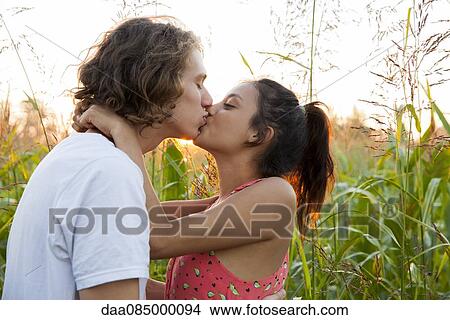 Young couple kissing View Large Photo Image Picture - Young couple kissing. Fotosearch