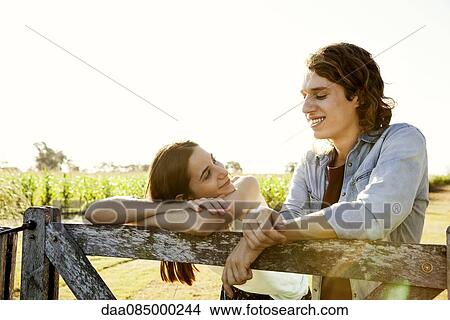 Young couple spending time together in countryside View Large Photo Image Picture - Young couple spending time together in countryside. Fotosearch