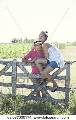 Young couple together on farm, portrait View Large Photo Image Picture - Young couple together on farm, portrait. Fotosearch