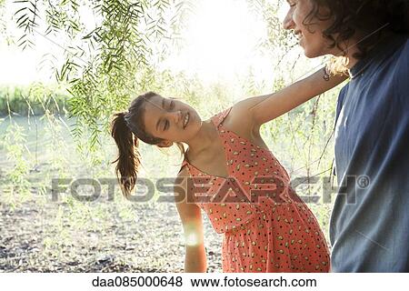 Young couple together outdoors View Large Photo Image Stock Photo - Young couple together outdoors. Fotosearch