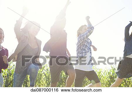 Young people boldly facing challenges of future together View Large Photo Image Stock Photograph - Young people boldly facing challenges of future together. Fotosearch