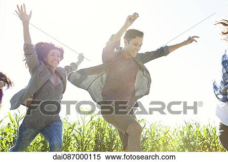 Young people leaping with exuberance View Large Photo Image Stock Photography - Young people leaping with exuberance. Fotosearch