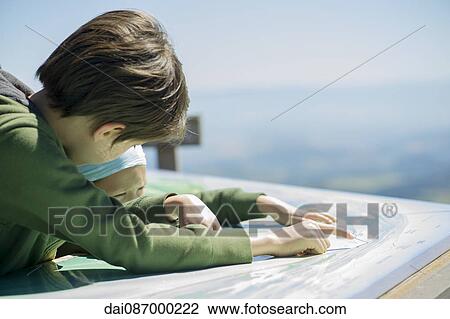 Young siblings studing map at scenic overlook View Large Photo Image Stock Image - Young siblings studing map at scenic overlook. Fotosearch