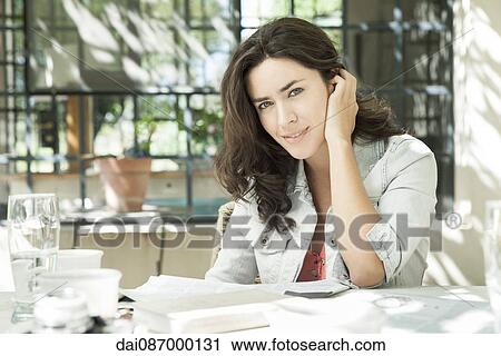 Young woman enjoying afternoon coffee break outdoors View Large Photo Image Stock Image - Young woman enjoying afternoon coffee break outdoors. Fotosearch