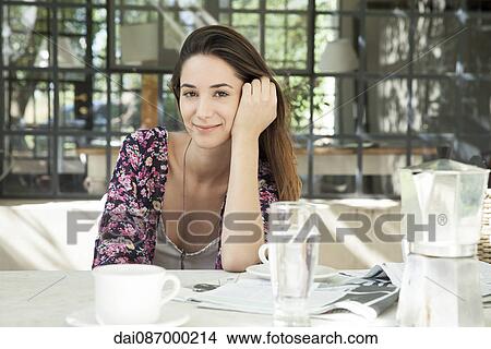 Young woman enjoying meal outdoors View Large Photo Image Picture - Young woman enjoying meal outdoors. Fotosearch