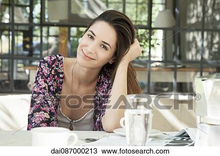 Young woman enjoying meal outdoors View Large Photo Image Stock Image - Young woman enjoying meal outdoors. Fotosearch