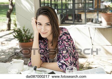 Young woman enjoying meal outdoors View Large Photo Image Stock Photo - Young woman enjoying meal outdoors. Fotosearch