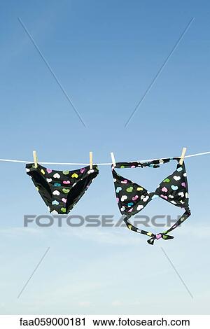 Bikini hanging on clothes-line View Large Photo Image Stock Image - Bikini hanging on clothes-line. Fotosearch