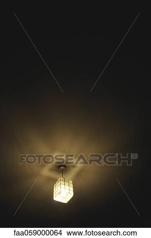 Ceiling light illuminated at night View Large Photo Image Picture - Ceiling light illuminated at night. Fotosearch