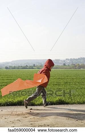 Child running with plastic bag View Large Photo Image Picture - Child running with plastic bag. Fotosearch