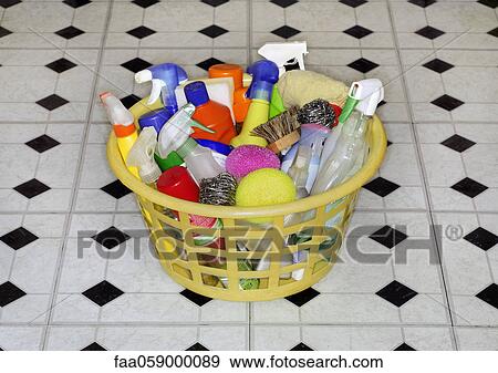 Stock Photo - Cleaning products in laundry basket. Fotosearch