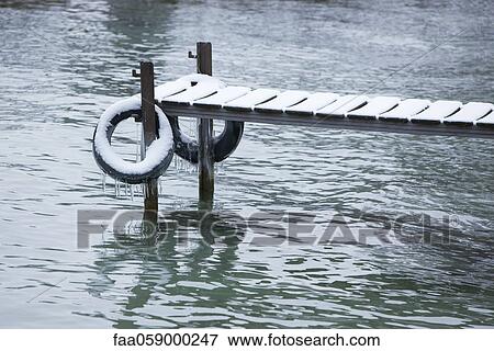 Dock covered with ice and snow View Large Photo Image Stock Photo - Dock covered with ice and snow. Fotosearch