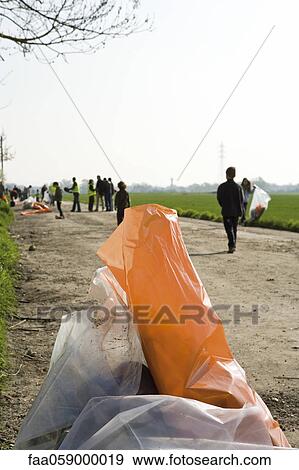 Garbage bags full of trash collected from side of road View Large Photo Image Stock Photo - Garbage bags full of trash collected from side of road. Fotosearch