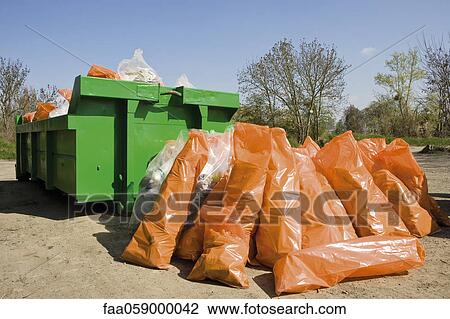 Garbage bags piled beside dumpster View Large Photo Image Stock Image - Garbage bags piled beside dumpster. Fotosearch