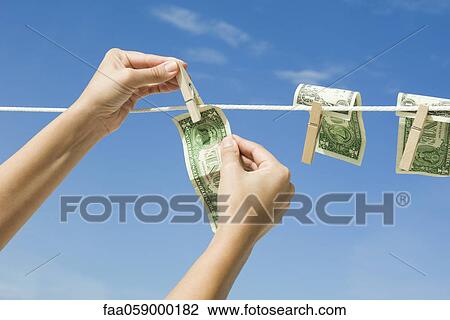 Hanging dollar bills on clothes-line View Large Photo Image Stock Image - Hanging dollar bills on clothes-line. Fotosearch