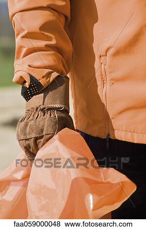 Holding garbage bag, cropped View Large Photo Image Stock Photo - Holding garbage bag, cropped. Fotosearch