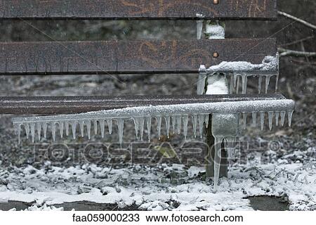 Icicles hanging from park bench View Large Photo Image Stock Image - Icicles hanging from park bench. Fotosearch