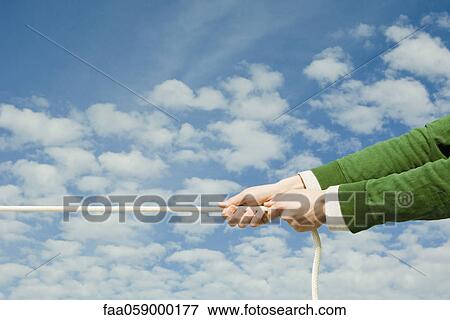 Person pulling end of rope View Large Photo Image Stock Photo - Person pulling end of rope. Fotosearch