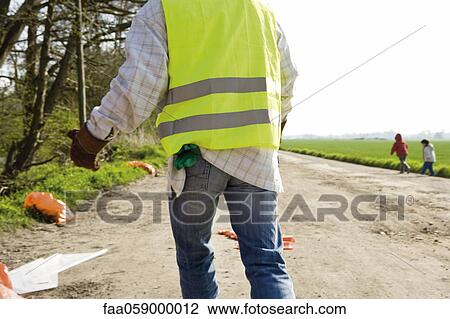 Picking up roadside litter View Large Photo Image Stock Image - Picking up roadside litter. Fotosearch