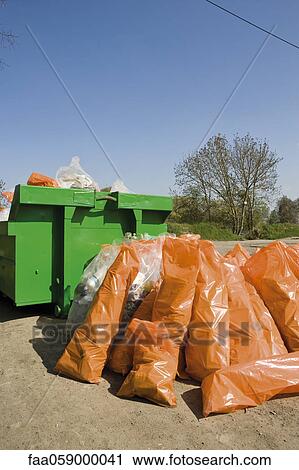 Pile of garbage bags by dumpster View Large Photo Image Stock Image - Pile of garbage bags by dumpster. Fotosearch