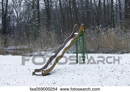 Playground slide covered in snow View Large Photo Image Picture - Playground slide covered in snow. Fotosearch
