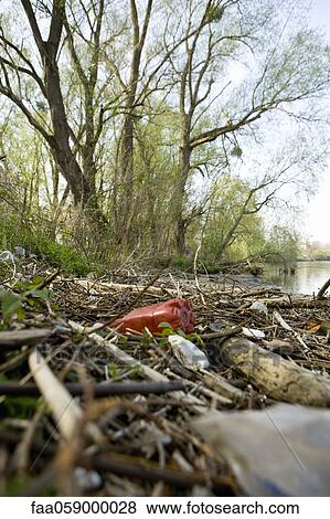 Trash by lake View Large Photo Image Stock Photo - Trash by lake. Fotosearch
