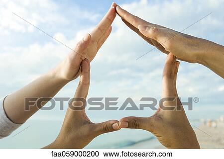 Two people's hands making finger frame View Large Photo Image Stock Image - Two people's hands making finger frame. Fotosearch