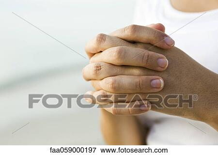 Woman's clasped hands View Large Photo Image Stock Photo - Woman's clasped hands. Fotosearch