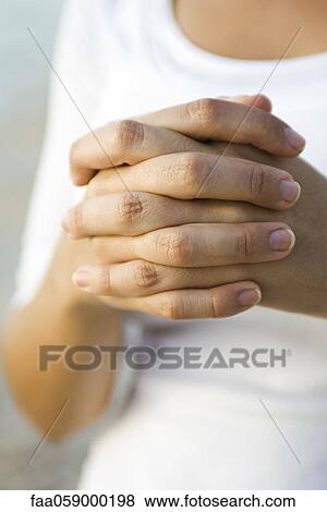 Woman's clasped hands View Large Photo Image Stock Photo - Woman's clasped hands. Fotosearch