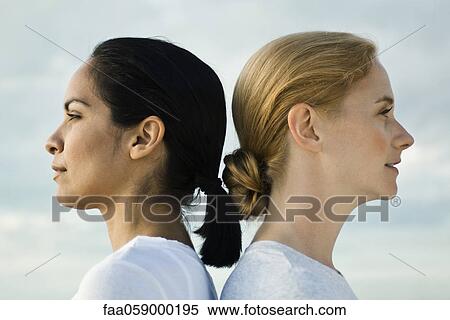 Women back to back, portrait View Large Photo Image Stock Photography - Women back to back, portrait. Fotosearch