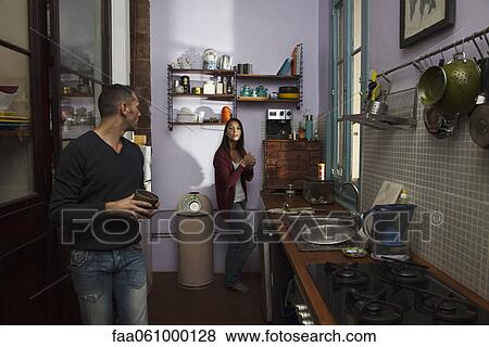Couple in kitchen together View Large Photo Image Stock Photo - Couple in kitchen together. Fotosearch