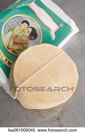 Stock Photography - Fresh package of uncooked papadum. Fotosearch