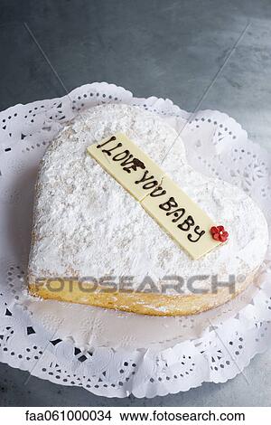 Heart-shaped pastry with lettering on decorative white chocolate reading, "I love you baby" View Large Photo Image Picture - Heart-shaped pastry with lettering on decorative white chocolate reading, "I love you baby". Fotosearch