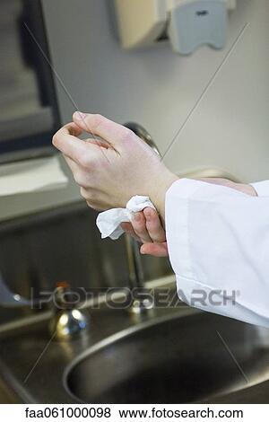 Washing and drying hands View Large Photo Image Stock Photo - Washing and drying hands. Fotosearch