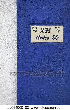Stock Image - Address painted on stucco wall. Fotosearch