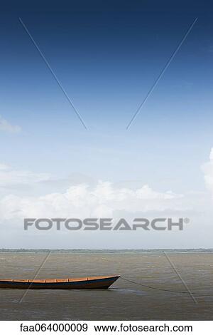 Canoe moored in shallow water View Large Photo Image Stock Photo - Canoe moored in shallow water. Fotosearch