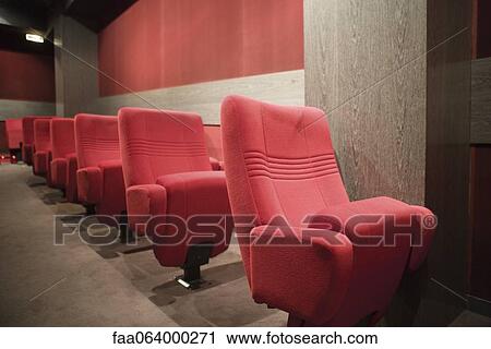 Stock Image - Empty seats in movie theater. Fotosearch