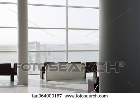 Empty waiting area in airport terminal View Large Photo Image Stock Photo - Empty waiting area in airport terminal. Fotosearch