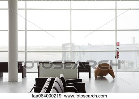 Empty waiting area in airport terminal View Large Photo Image Stock Photo - Empty waiting area in airport terminal. Fotosearch