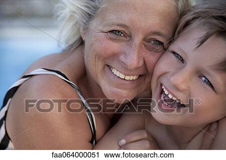 Grandmother and grandson laughing together outdoors, portrait View Large Photo Image Stock Image - Grandmother and grandson laughing together outdoors, portrait. Fotosearch