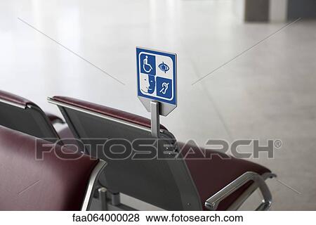 Sign in waiting area designating seating for persons with disabilities View Large Photo Image Stock Photo - Sign in waiting area designating seating for persons with disabilities. Fotosearch