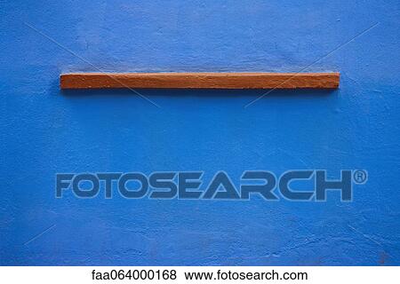 Stock Photo - Small ledge on blue stucco wall. Fotosearch