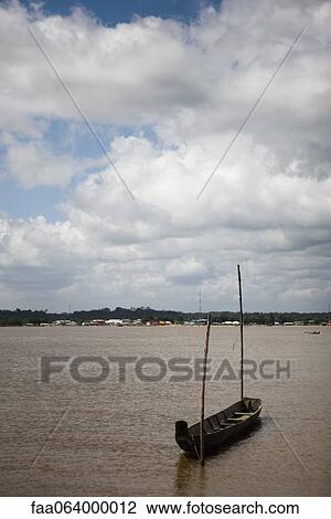 South America, Amazonia, boat tied to wooden posts in water View Large Photo Image Stock Image - South America, Amazonia, boat tied to wooden posts in water. Fotosearch