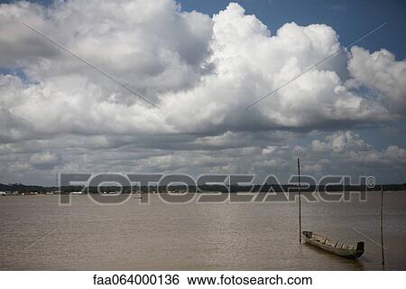 South America, Amazonia, boat tied to wooden posts in water View Large Photo Image Stock Photograph - South America, Amazonia, boat tied to wooden posts in water. Fotosearch