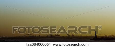 Picture - USA, New York City, New York Harbor at sunset. Fotosearch