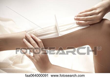 Woman waxing legs, cropped View Large Photo Image Stock Image - Woman waxing legs, cropped. Fotosearch